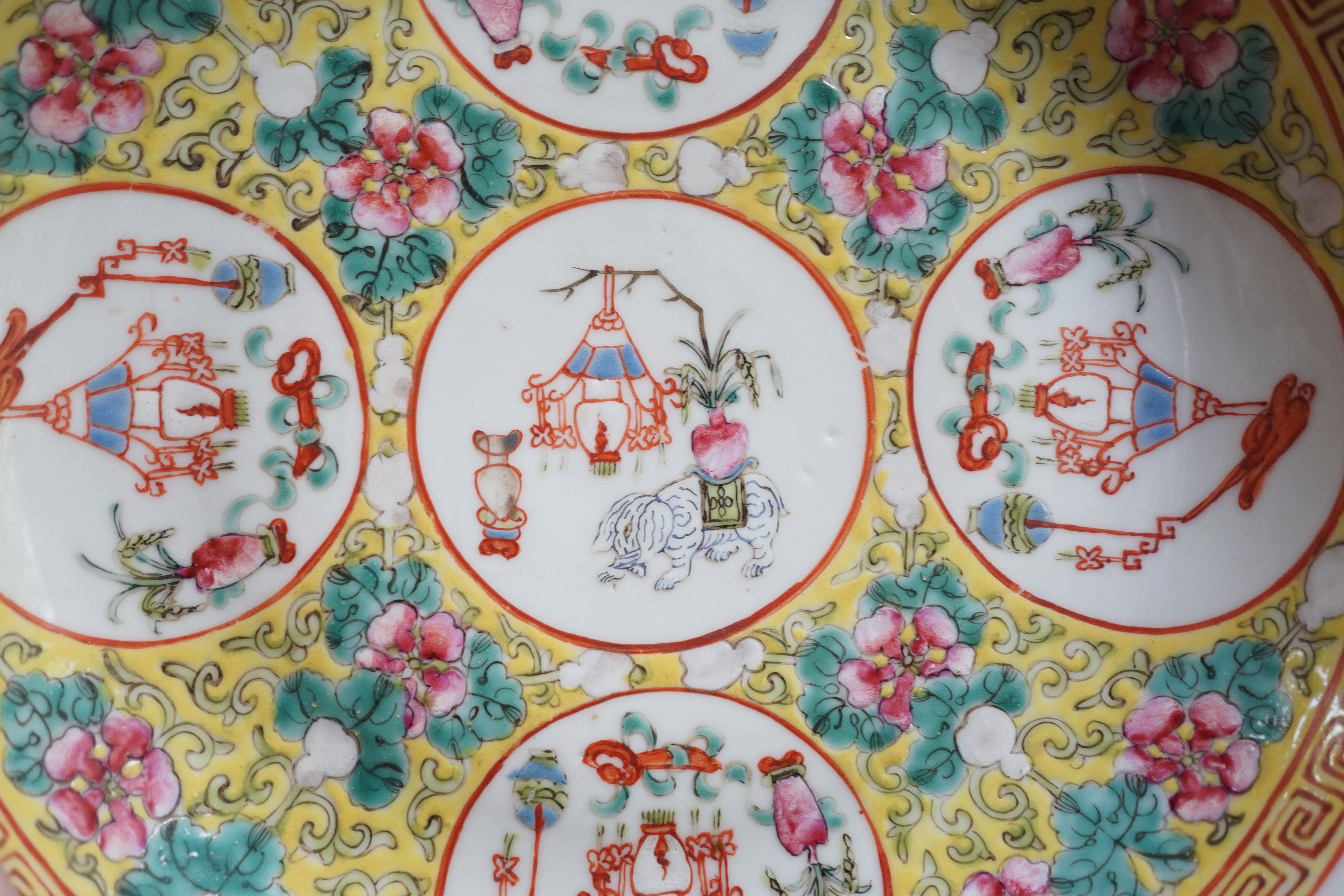 A pair of Chinese yellow ground medallion saucer dishes, Guangxu six character marks, early 20th century, hairline crack to one dish